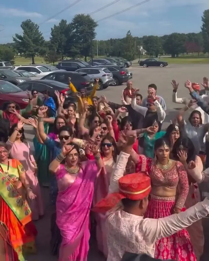 Crowd dancing outdoors in bright colors
