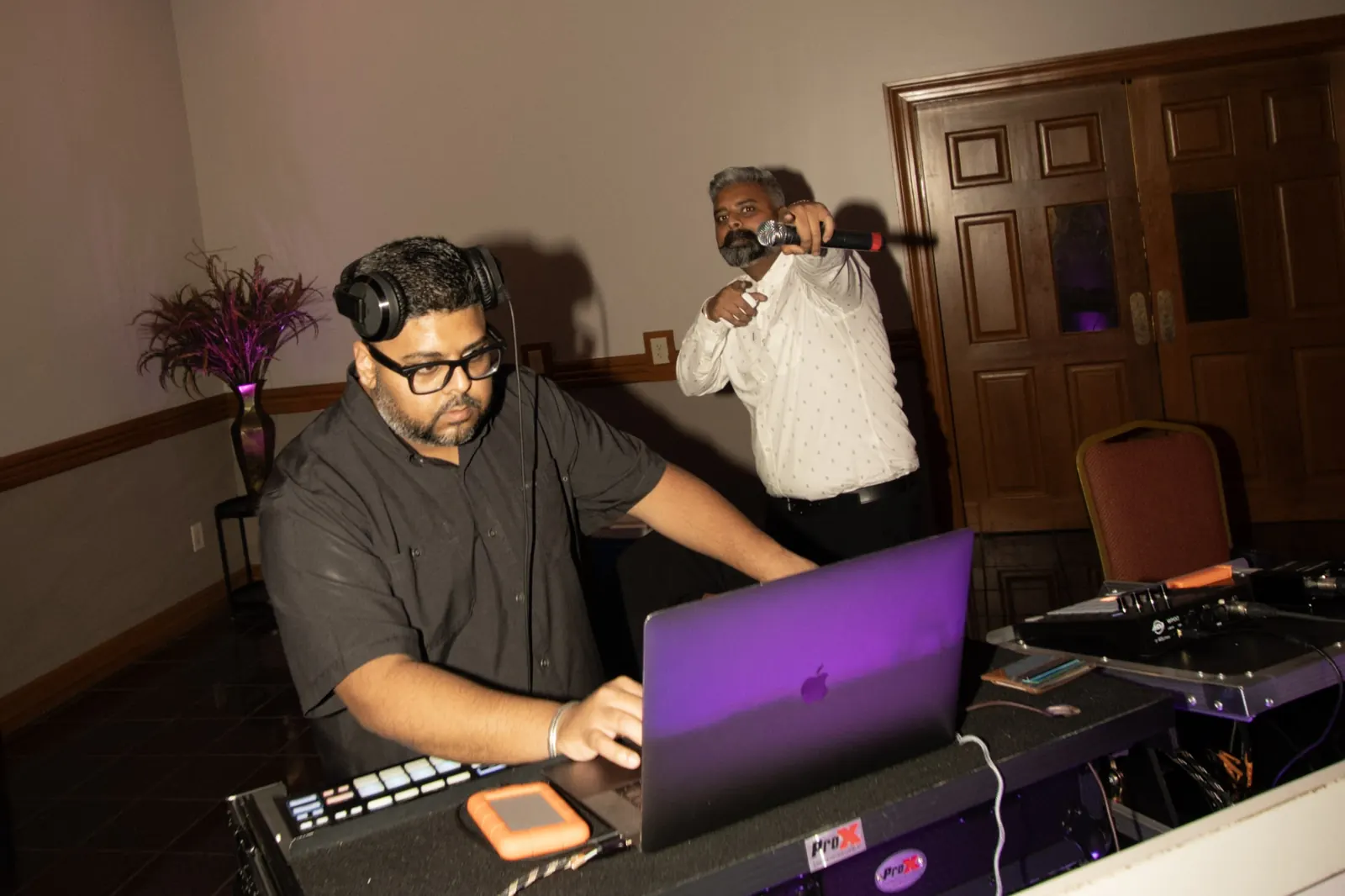 DJ Ravi mixing while Kaka G hypes the crowd on the mic