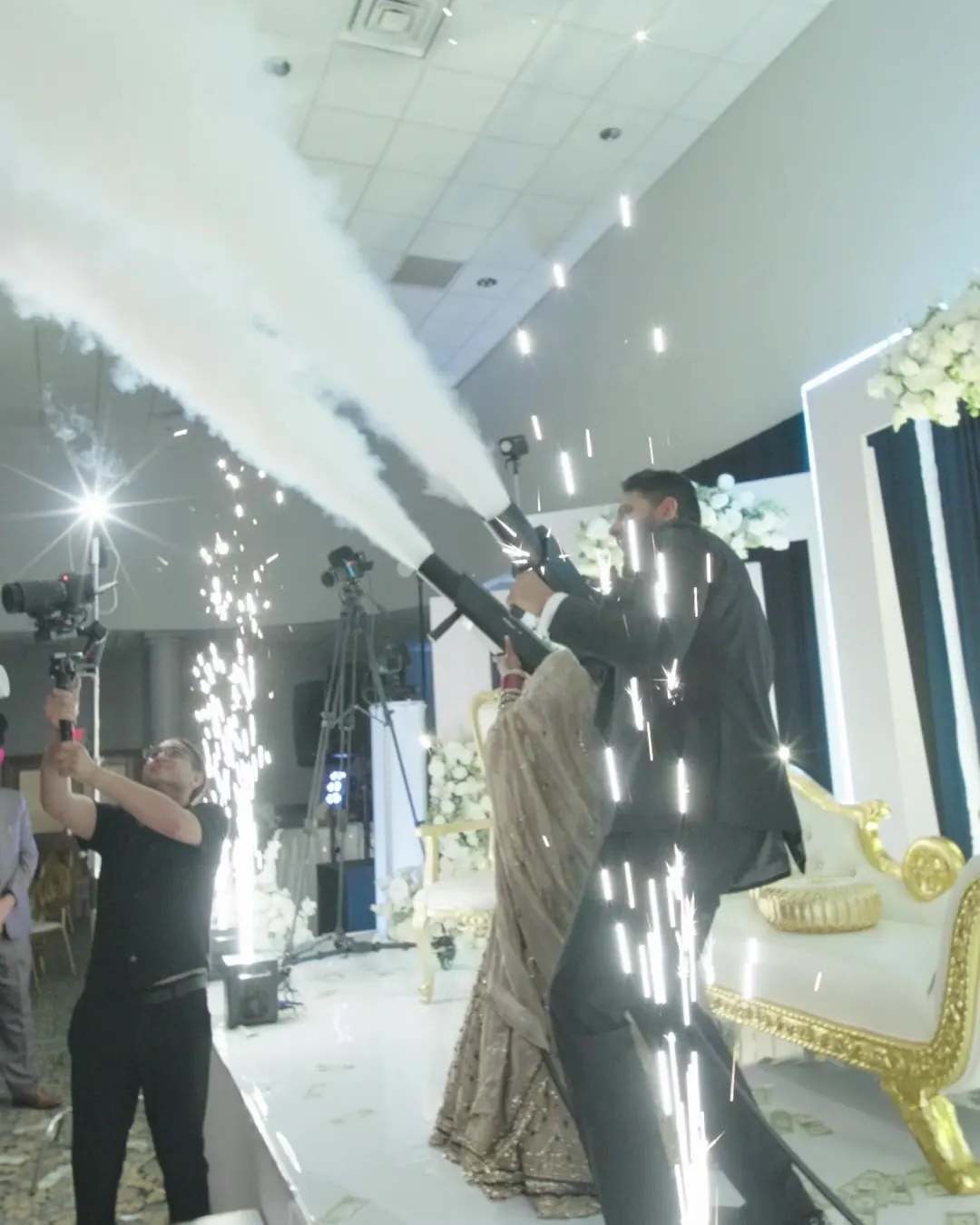 Couple entering through cold sparks and CO2 jets